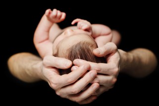 Male hands with baby