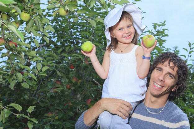 A girl and her daddy with apple background