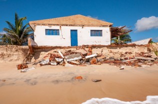 Eroded beach with house, Pititinga, Natal (Brazil)