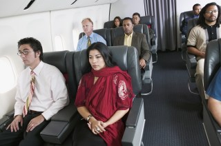 Group of passengers on airplane