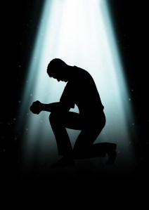Silhouette illustration of a man praying under the light