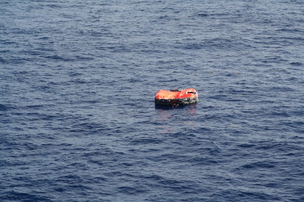 A life raft floats in mid ocean awaiting rescue