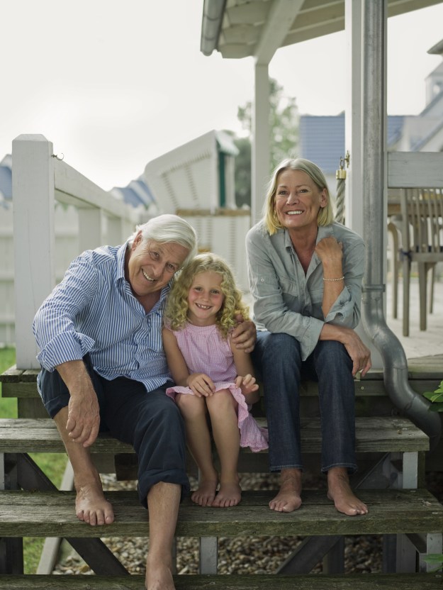 Happy portrait of grandparents and granddaughter
